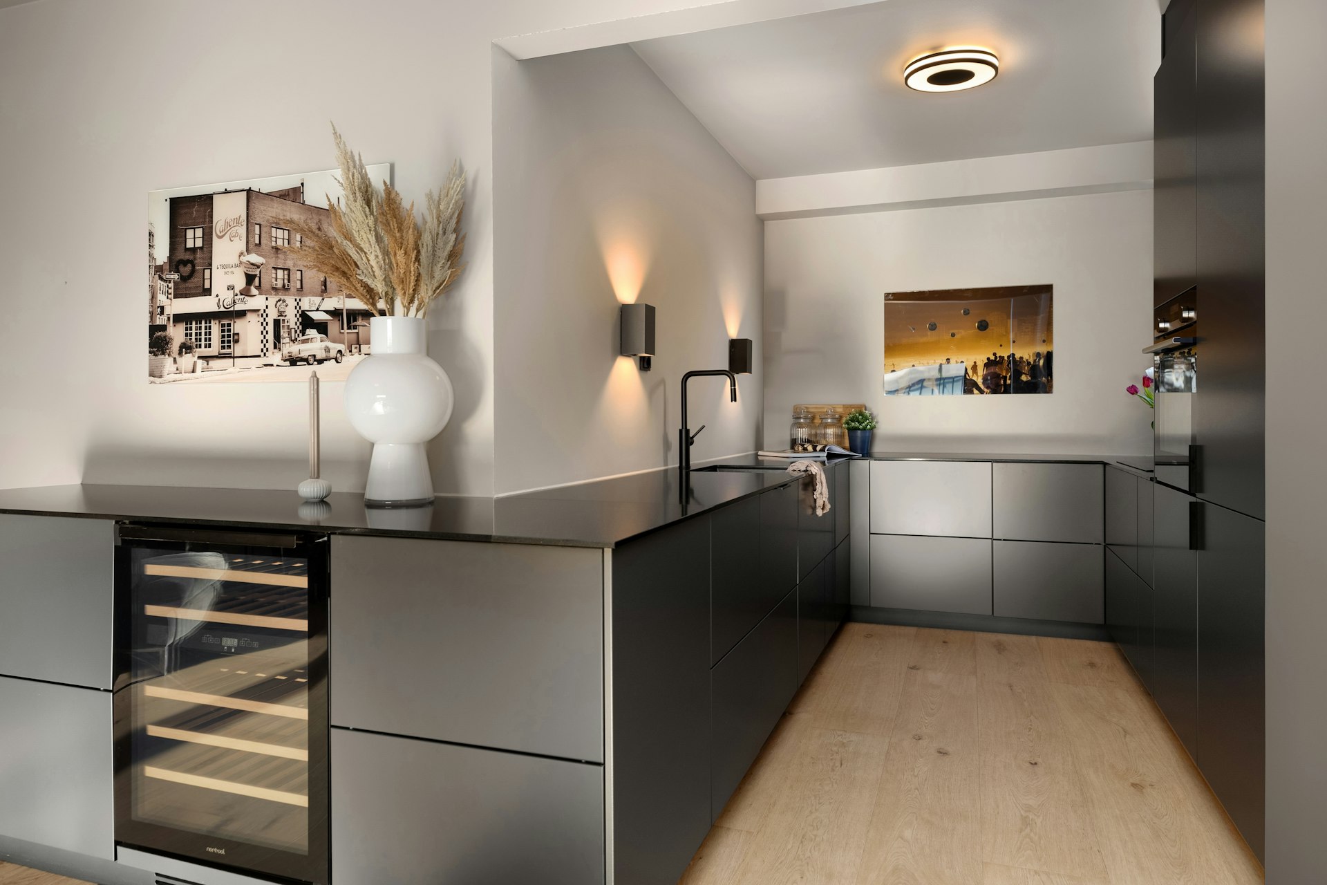 A kitchen with a counter and a wine rack
